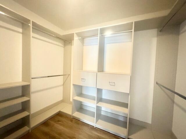 708 Caribbean Way Niceville, FL 32578 - Photo 28 of 34 a view of walk in closet with empty racks