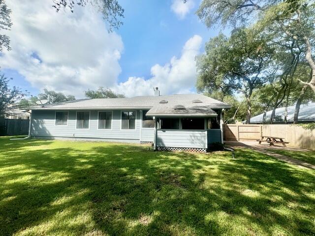 708 Caribbean Way Niceville, FL 32578 - Photo 34 of 34 a backyard of a house with table and chairs