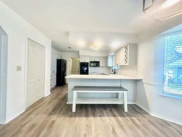 a living room with a couch and windows