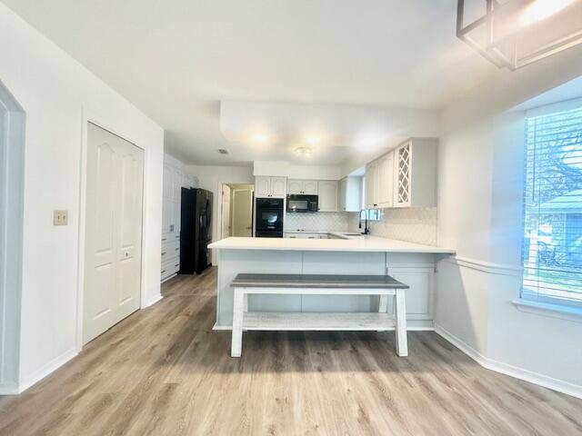 708 Caribbean Way Niceville, FL 32578 - Photo 10 of 34 a living room with a couch and windows