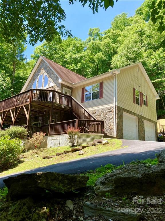 160 Flying Hawk Road Waynesville, NC 28786 - Photo 2 of 45 a view of a house with swimming pool