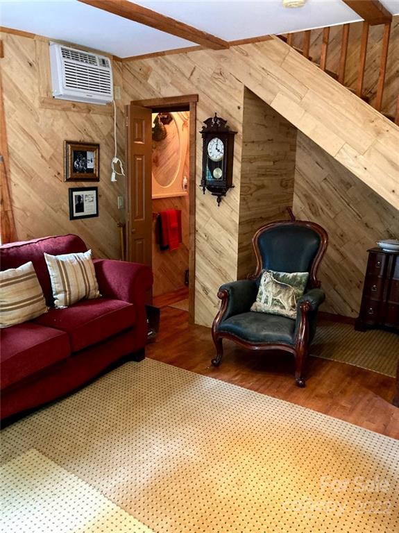 160 Flying Hawk Road Waynesville, NC 28786 - Photo 22 of 45 a living room with furniture and a wooden floor