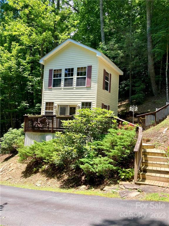 160 Flying Hawk Road Waynesville, NC 28786 - Photo 24 of 45 a front view of a house with a yard