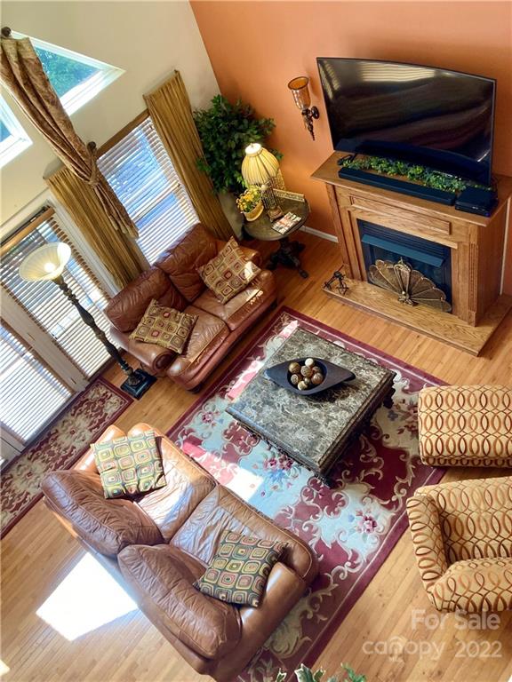 160 Flying Hawk Road Waynesville, NC 28786 - Photo 27 of 45 a living room with furniture and a book shelf