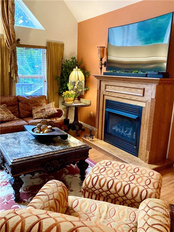 160 Flying Hawk Road Waynesville, NC 28786 - Photo 28 of 45 a living room with furniture and a fireplace