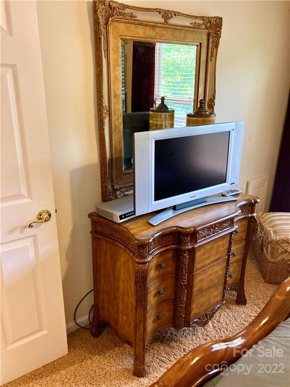 160 Flying Hawk Road Waynesville, NC 28786 - Photo 32 of 45 a living room with a flat screen tv and a fireplace