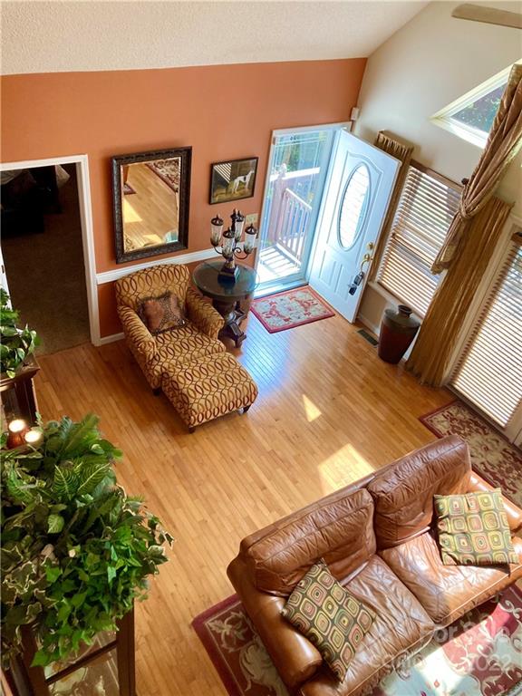 160 Flying Hawk Road Waynesville, NC 28786 - Photo 4 of 45 a living room with furniture rug and wooden floor