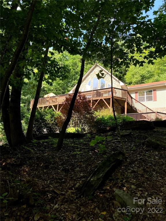 160 Flying Hawk Road Waynesville, NC 28786 - Photo 42 of 45 a backyard of a house with lots of green space