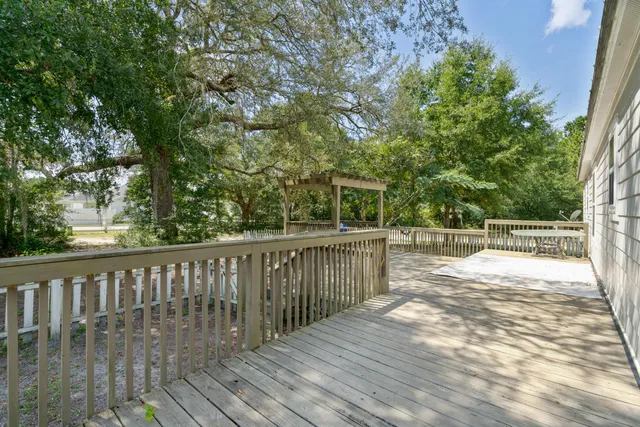 a view of balcony with deck and wooden floor