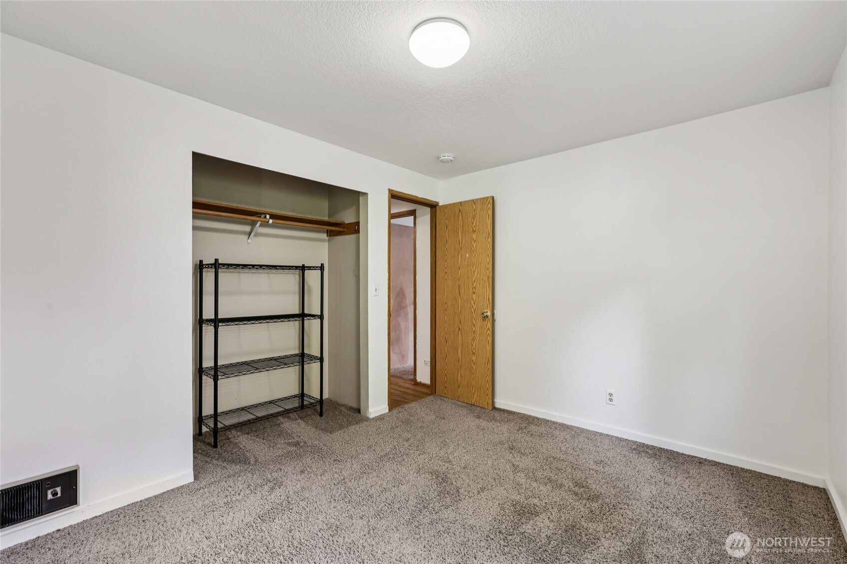 8032 71st Place Southeast Snohomish, WA 98290 - Photo 11 of 32 a view of an empty room with closet and a window