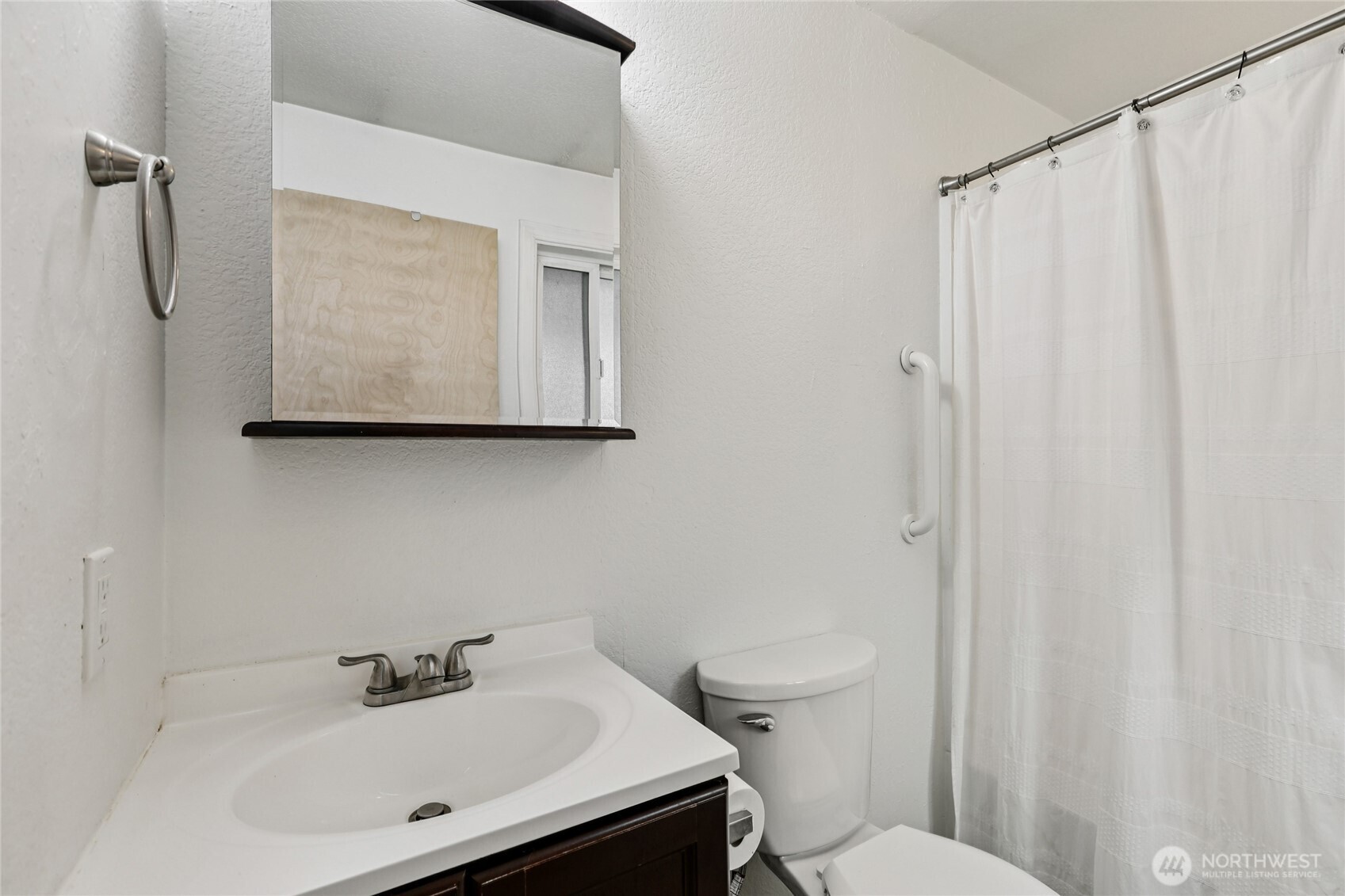8032 71st Place Southeast Snohomish, WA 98290 - Photo 14 of 32 a bathroom with a sink a toilet and shower