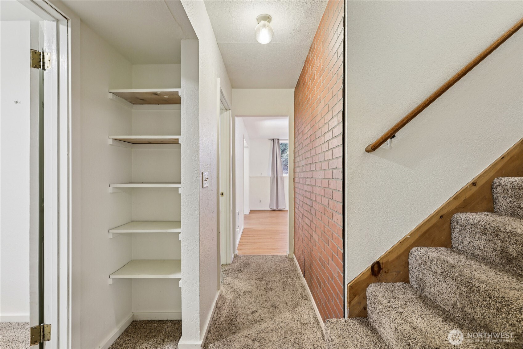 8032 71st Place Southeast Snohomish, WA 98290 - Photo 17 of 32 a view of a hallway with wooden floor and staircase