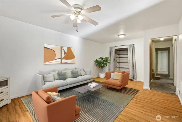 a living room with furniture and a chandelier