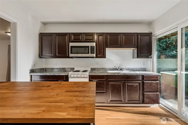a bedroom with a bed and a desk