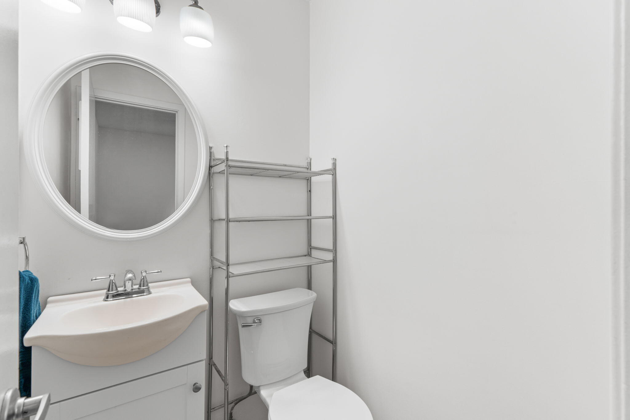 212 Aza Place Crestview, FL 32539 - Photo 14 of 30 a bathroom with a toilet sink and mirror