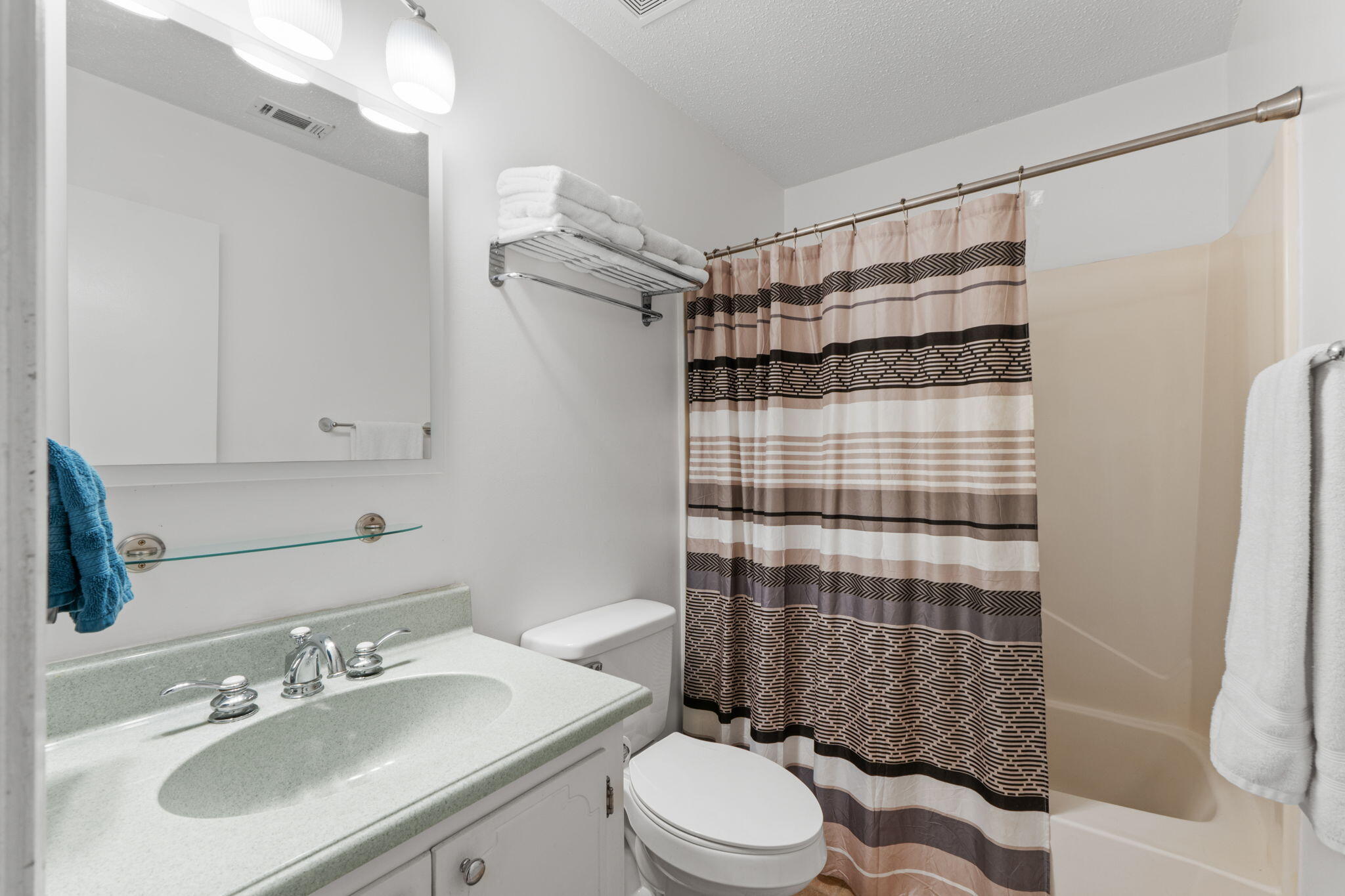 212 Aza Place Crestview, FL 32539 - Photo 16 of 30 a bathroom with a sink toilet and shower