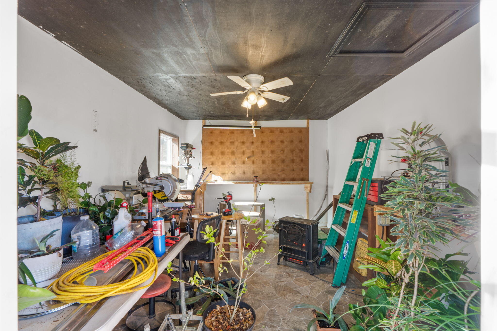212 Aza Place Crestview, FL 32539 - Photo 22 of 30 a room with lots of stuff and potted plants