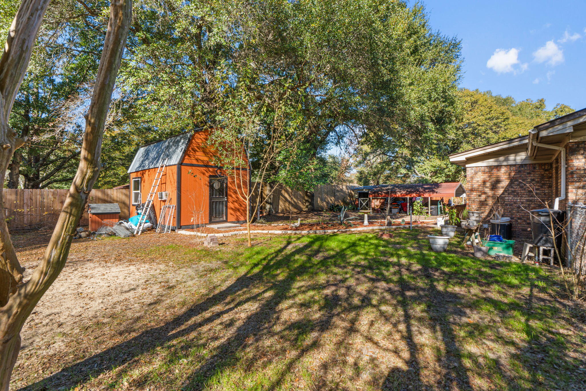 212 Aza Place Crestview, FL 32539 - Photo 23 of 30 a backyard of a house with lots of green space