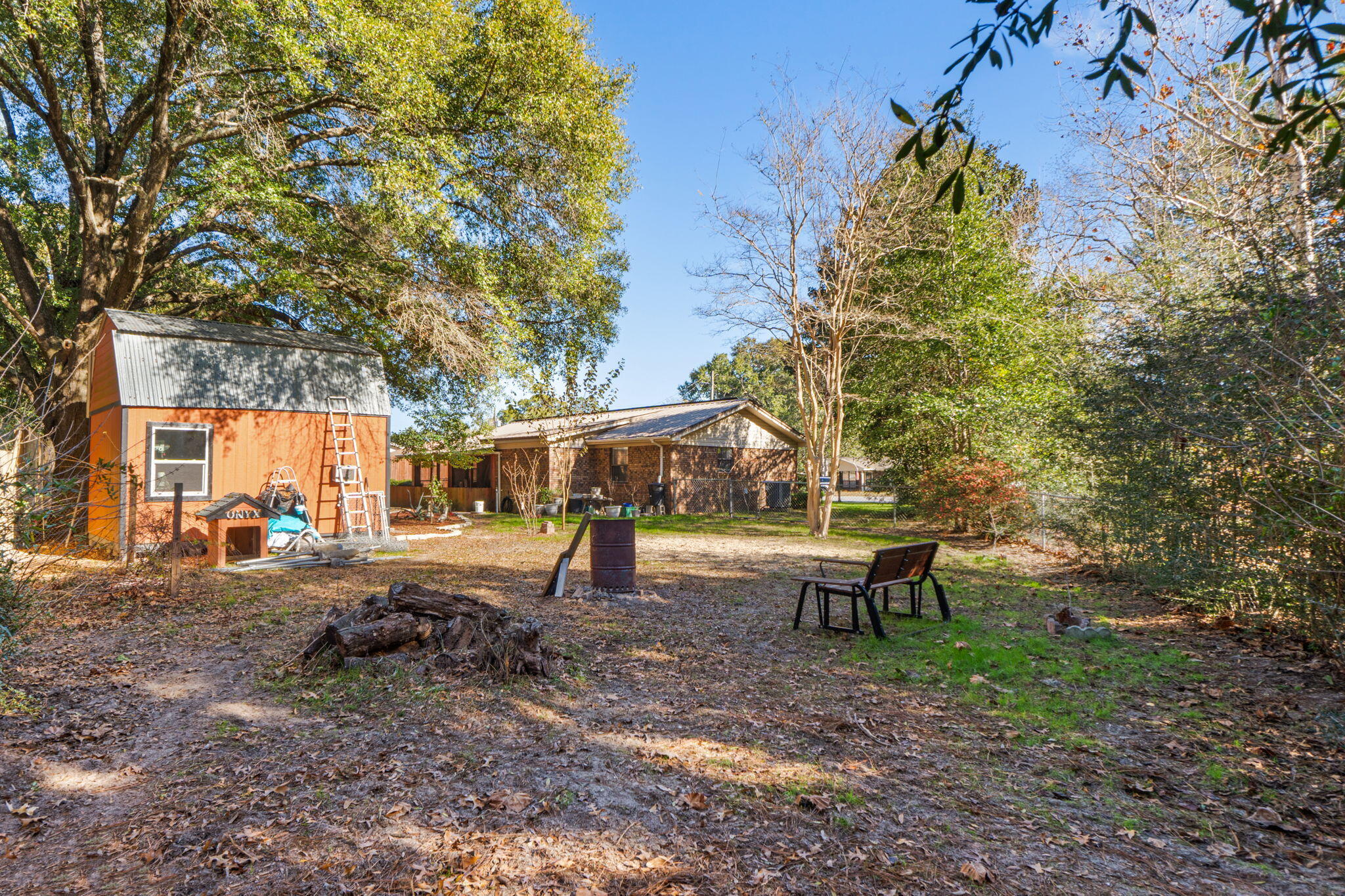 212 Aza Place Crestview, FL 32539 - Photo 24 of 30 a view of a backyard with large trees