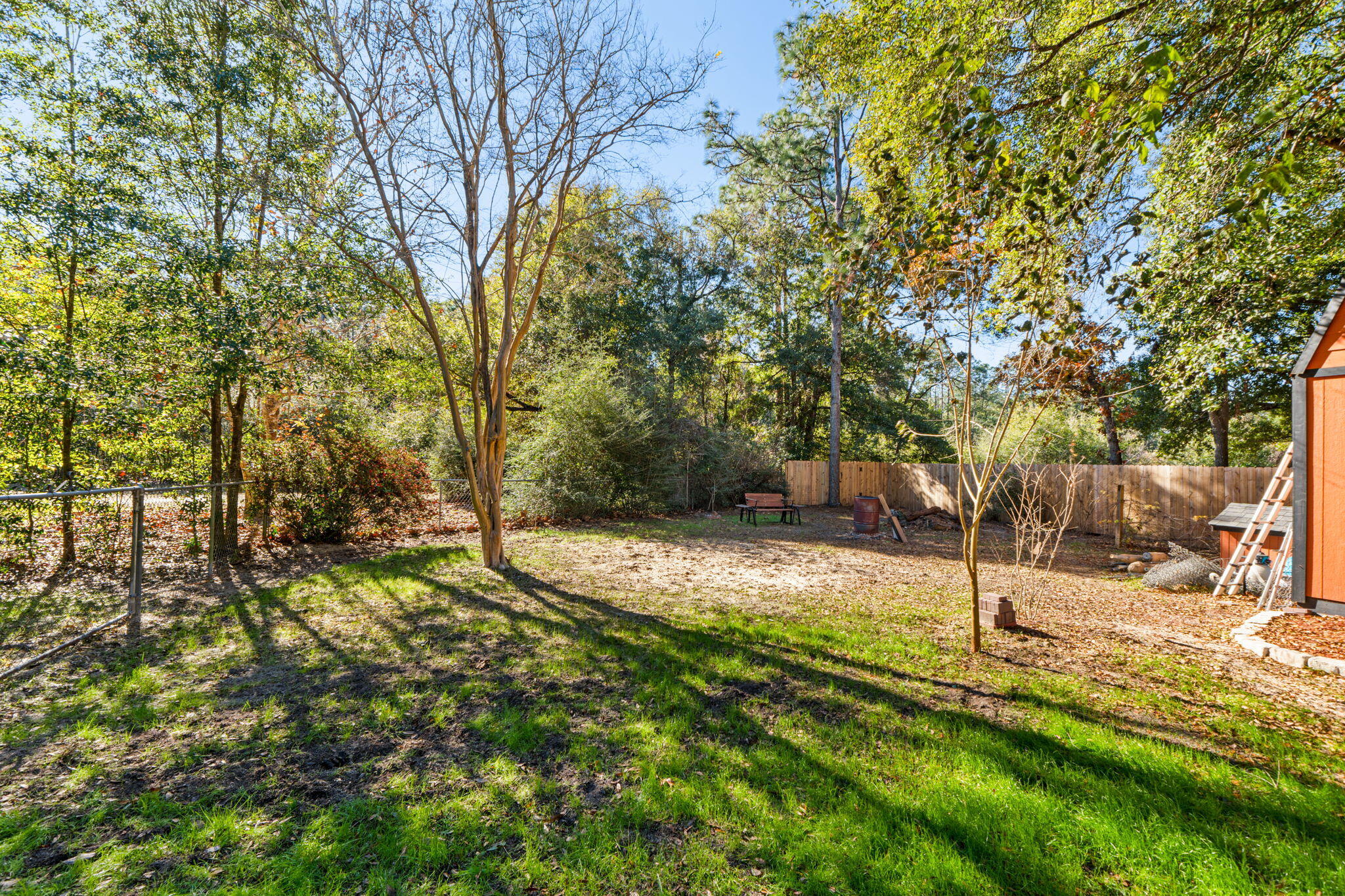 212 Aza Place Crestview, FL 32539 - Photo 25 of 30 a view of a yard with plants and trees