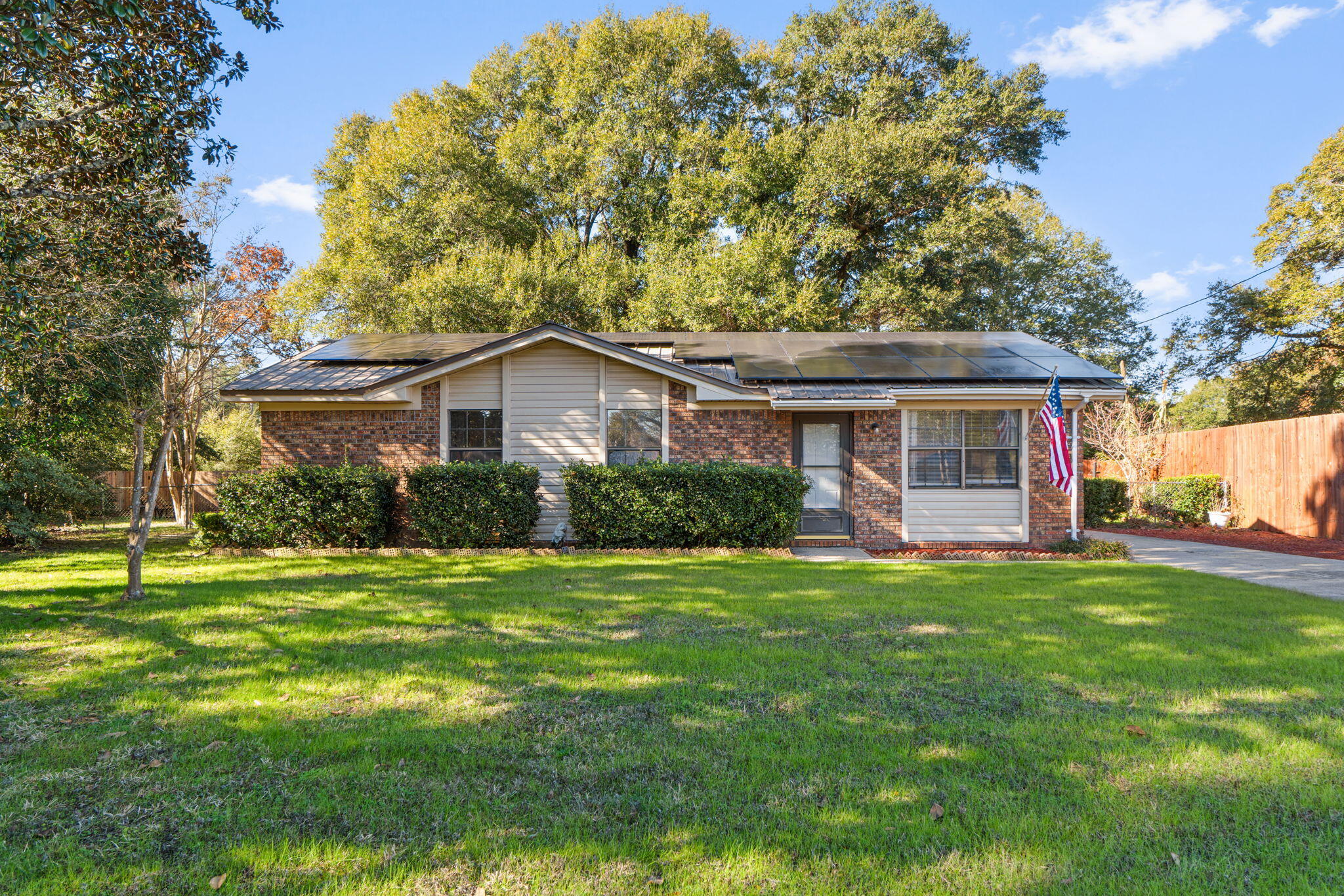 212 Aza Place Crestview, FL 32539 - Photo 28 of 30 a front view of a house with a garden