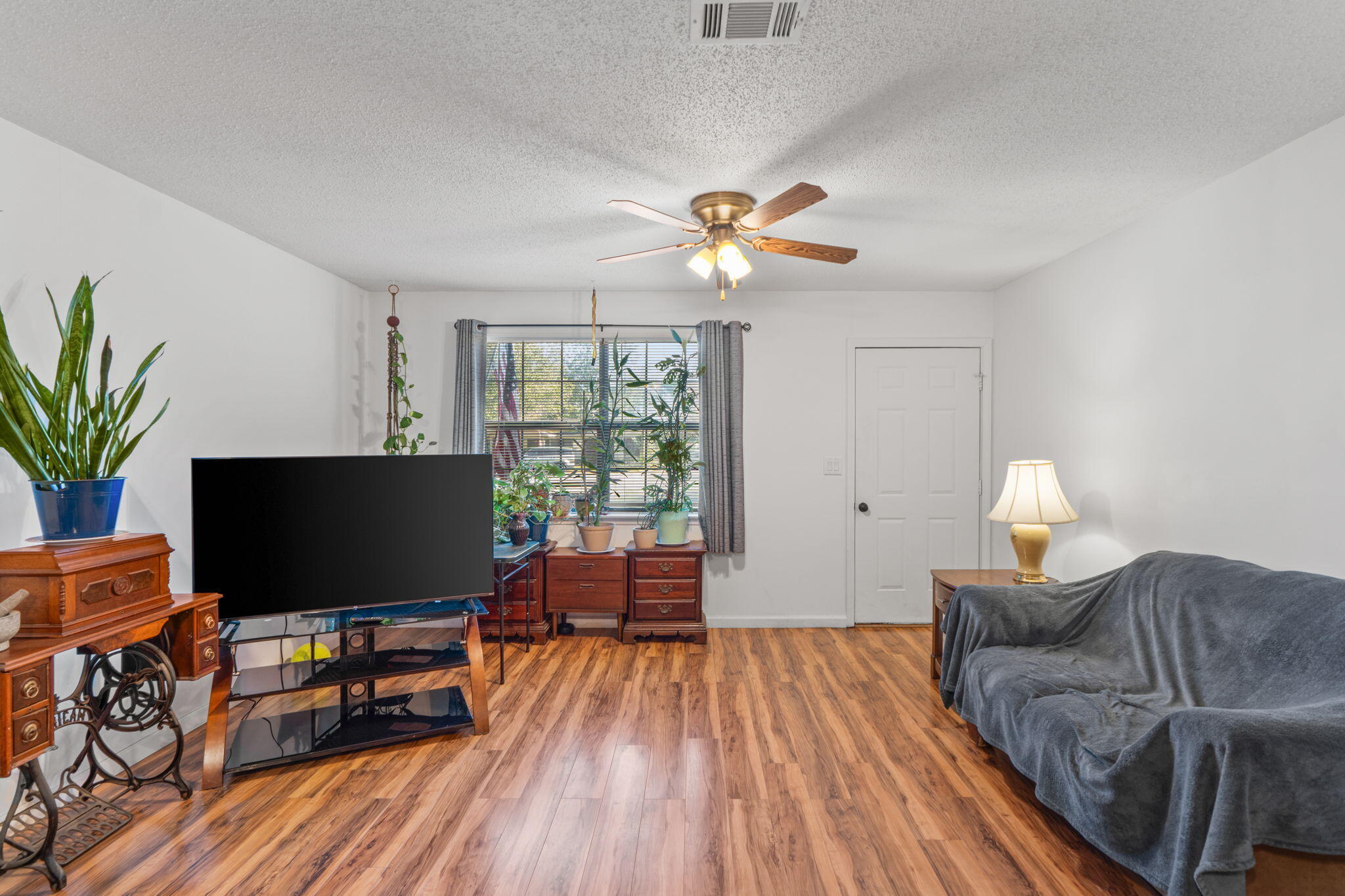 212 Aza Place Crestview, FL 32539 - Photo 3 of 30 a living room with furniture and a flat screen tv
