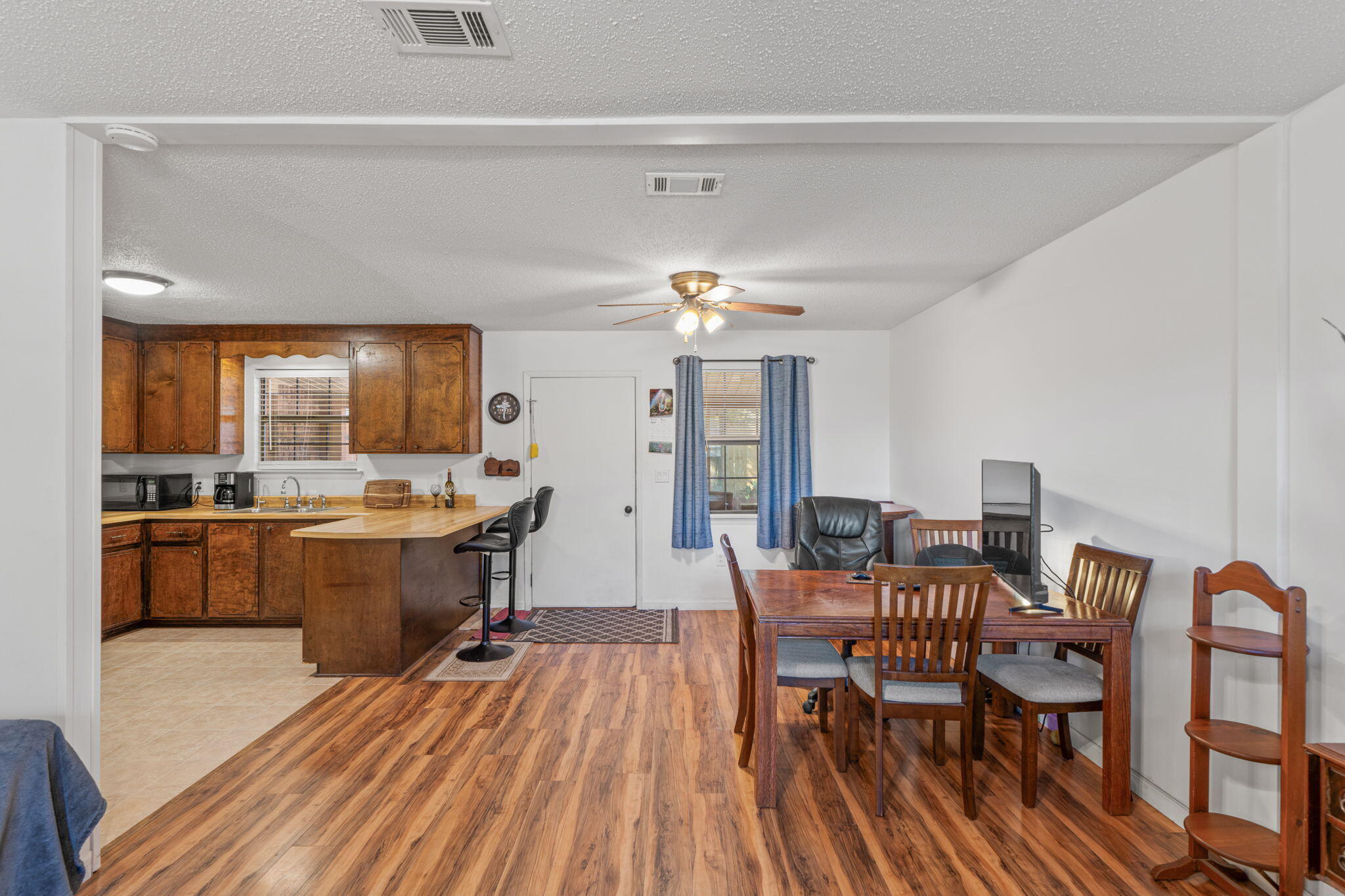 212 Aza Place Crestview, FL 32539 - Photo 5 of 30 a dining room with furniture and wooden floor