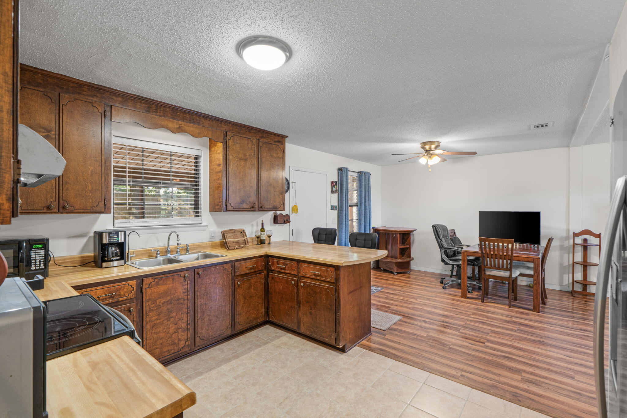 212 Aza Place Crestview, FL 32539 - Photo 7 of 30 a kitchen with a sink and cabinets