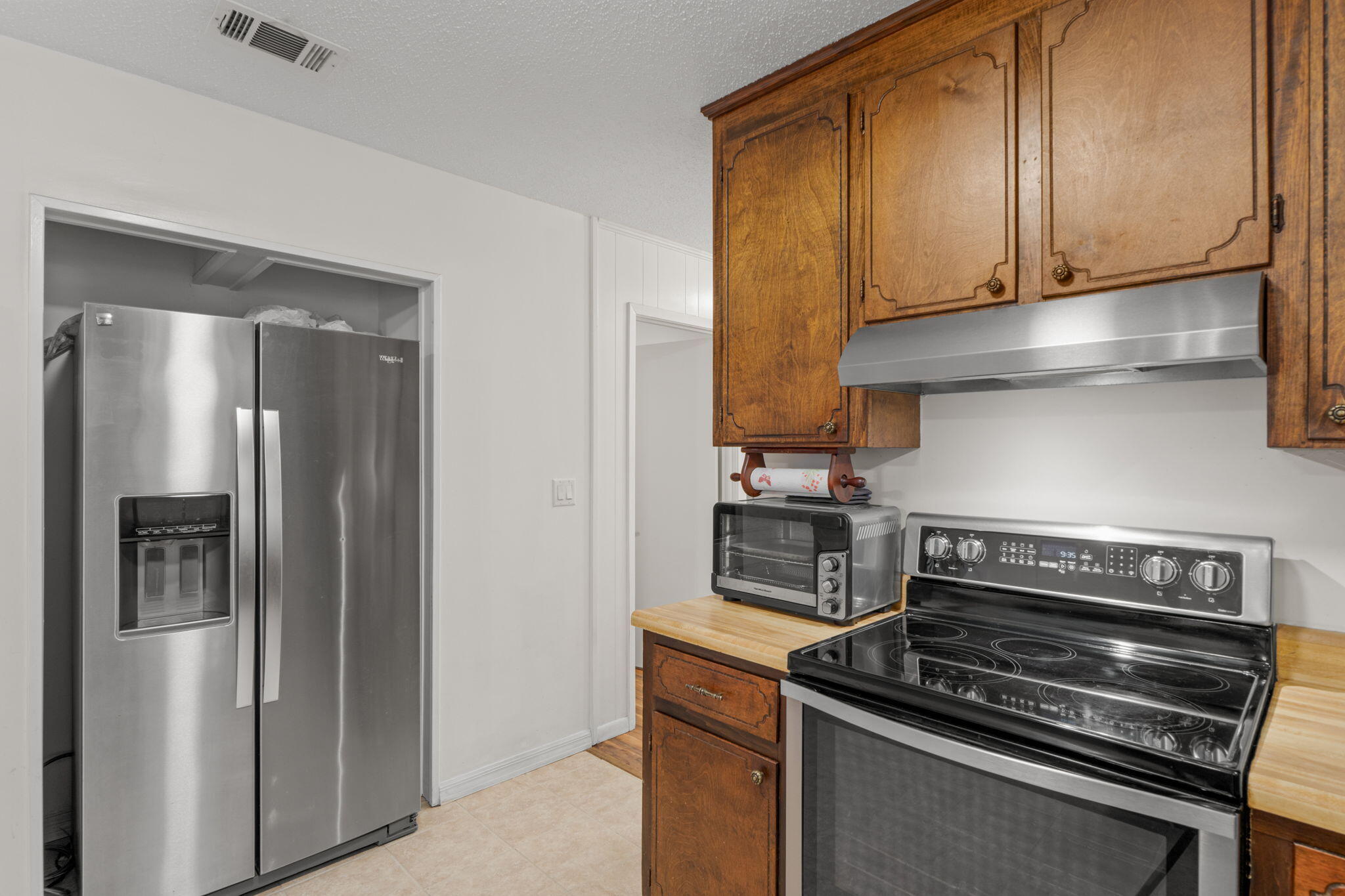 212 Aza Place Crestview, FL 32539 - Photo 9 of 30 a kitchen with stainless steel appliances and cabinets