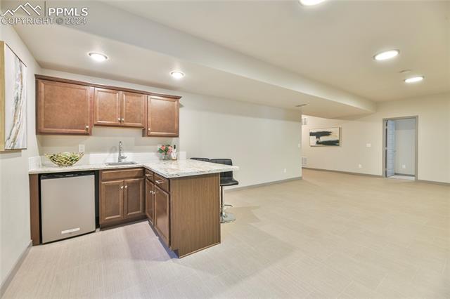 5126 Pring Ranch Road Colorado Springs, CO 80922 - Photo 21 of 32 Wet bar in the basement.