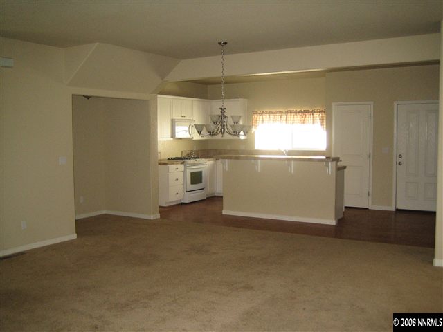 3270 Paragon Place Reno, NV 89509 - Photo 3 of 9 a view of a kitchen with a sink dishwasher and wooden floor