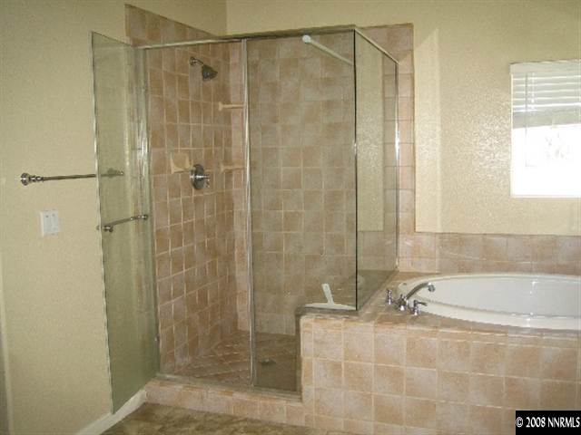 3270 Paragon Place Reno, NV 89509 - Photo 7 of 9 a bathroom with a shower and a sink