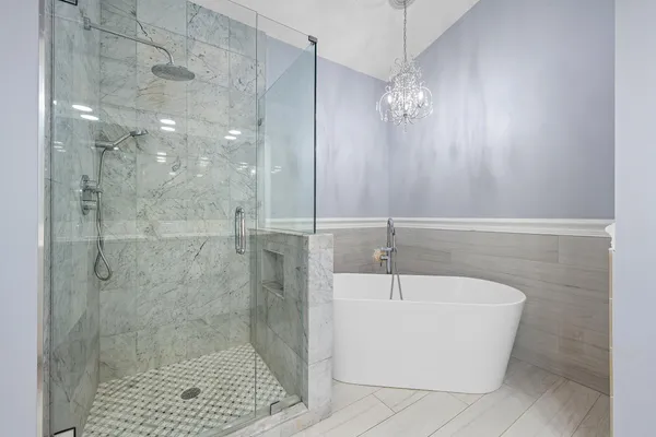 a bathroom with a bathtub and shower