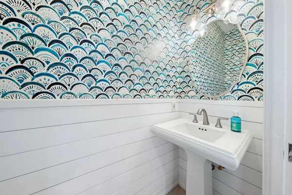 a bathroom with a sink and a mirror