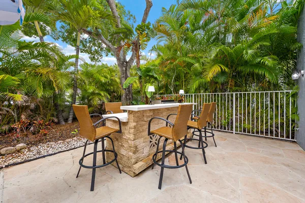 a view of a chairs and table in the patio