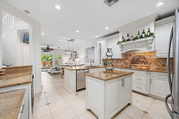 a kitchen with cabinets and window