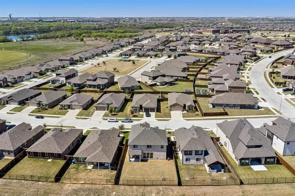 an aerial view of residential houses with outdoor space