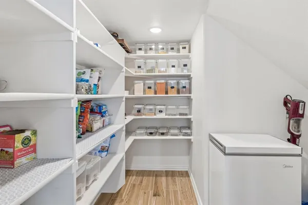 a view of a livingroom with workspace and a window