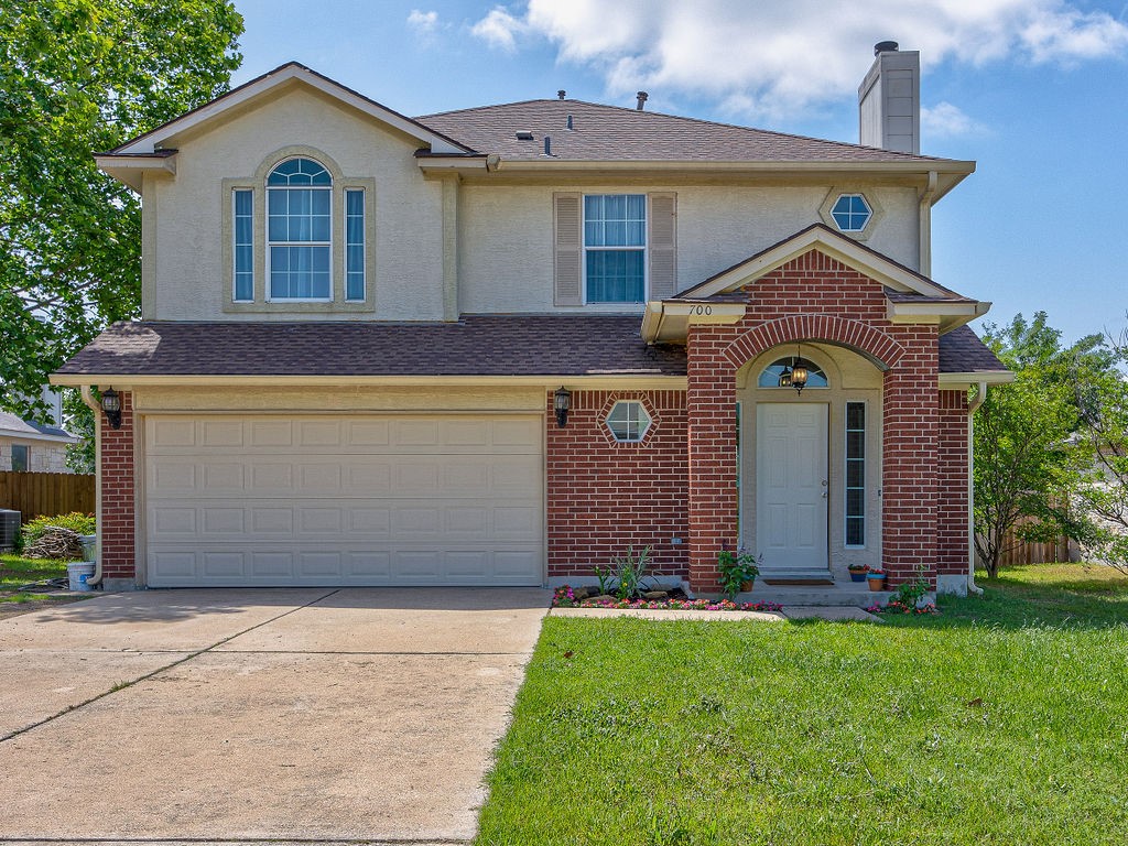 700 Los Robles Road Leander, TX 78641 - Photo 1 of 1 a front view of house with yard