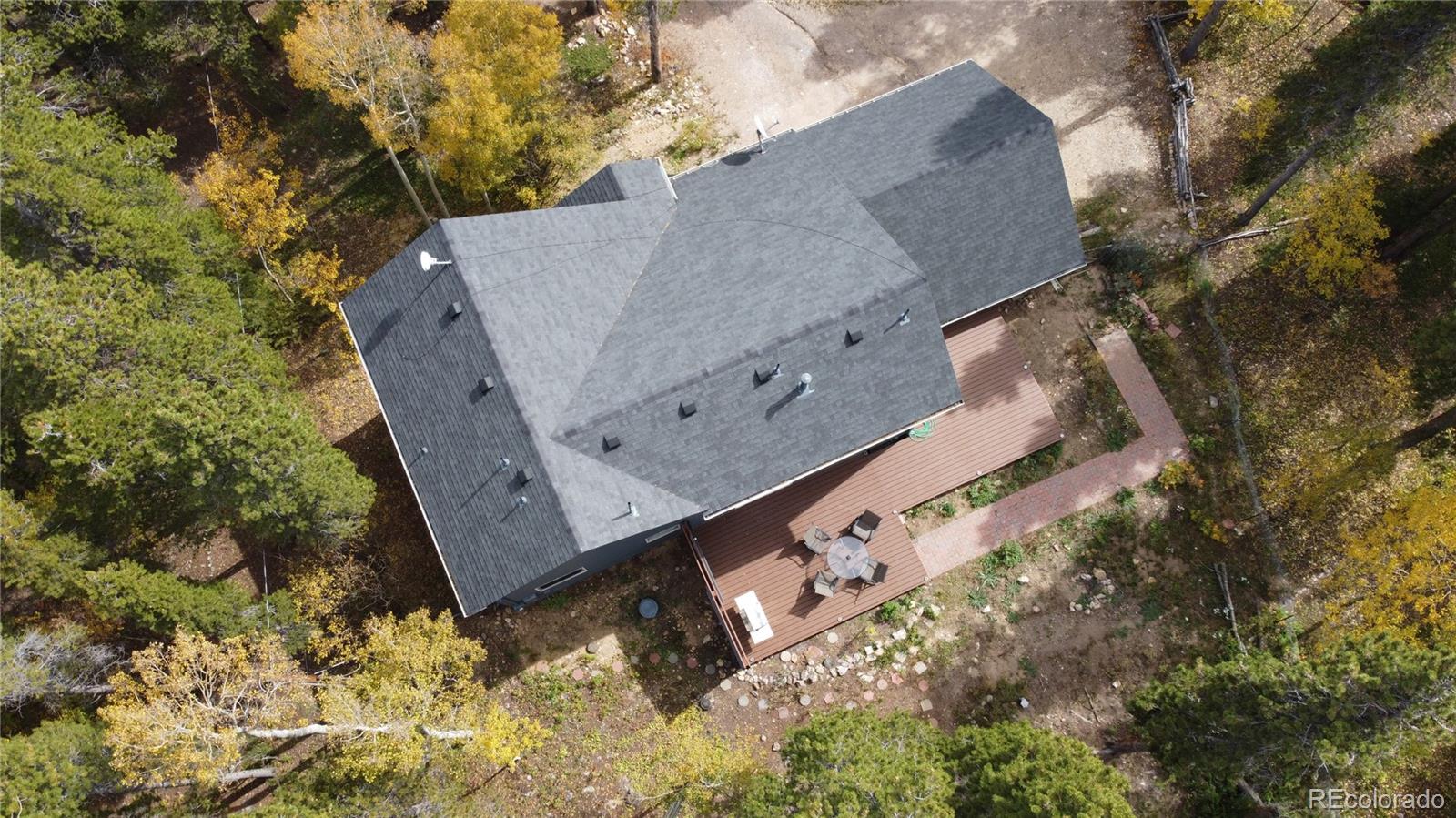 265 Caesar Road Black Hawk, CO 80422 - Photo 7 of 42 a view of a house with a yard and wooden fence