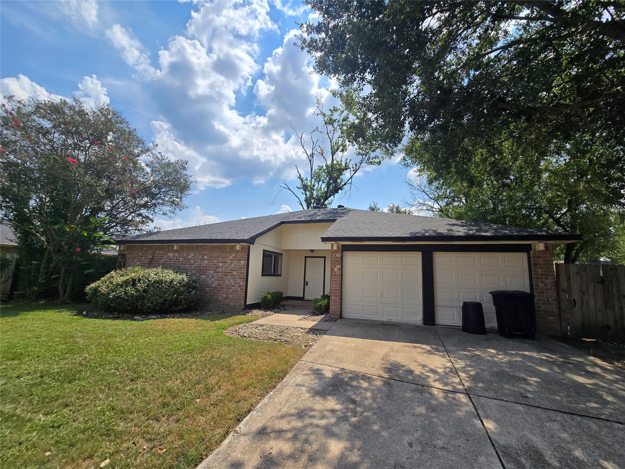 a view of a house with a yard and garage