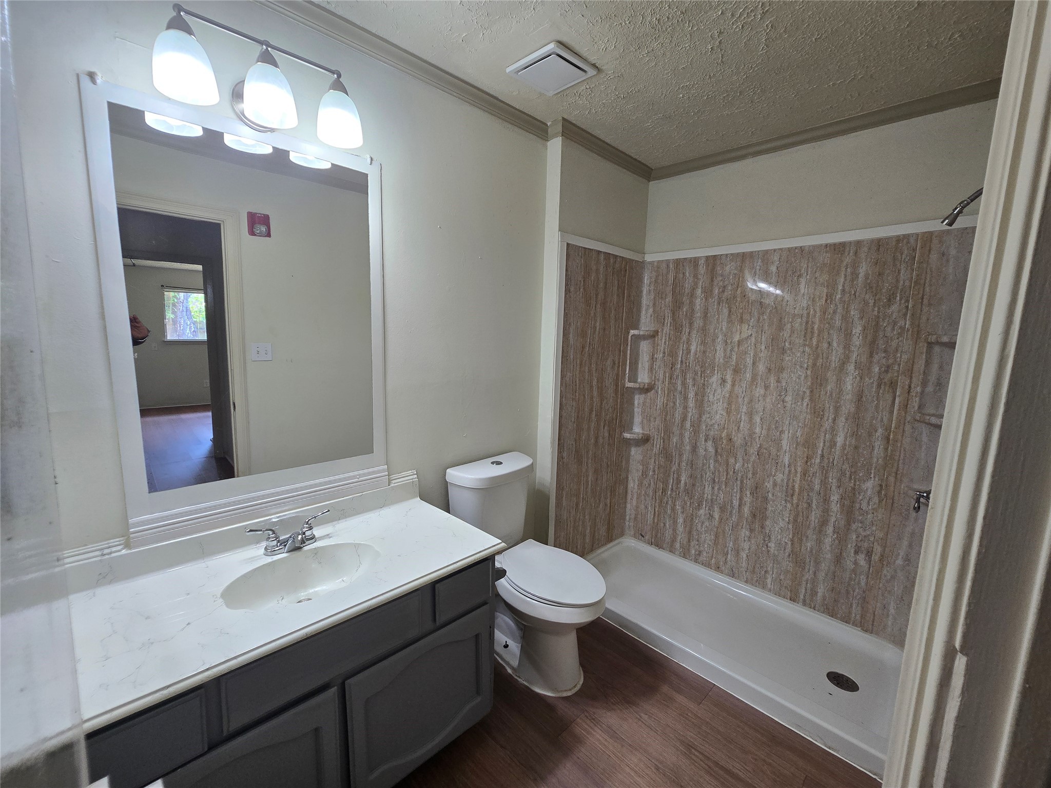 16331 Dew Drop Lane Houston, TX 77095 - Photo 12 of 20 a bathroom with a sink a toilet a mirror and shower