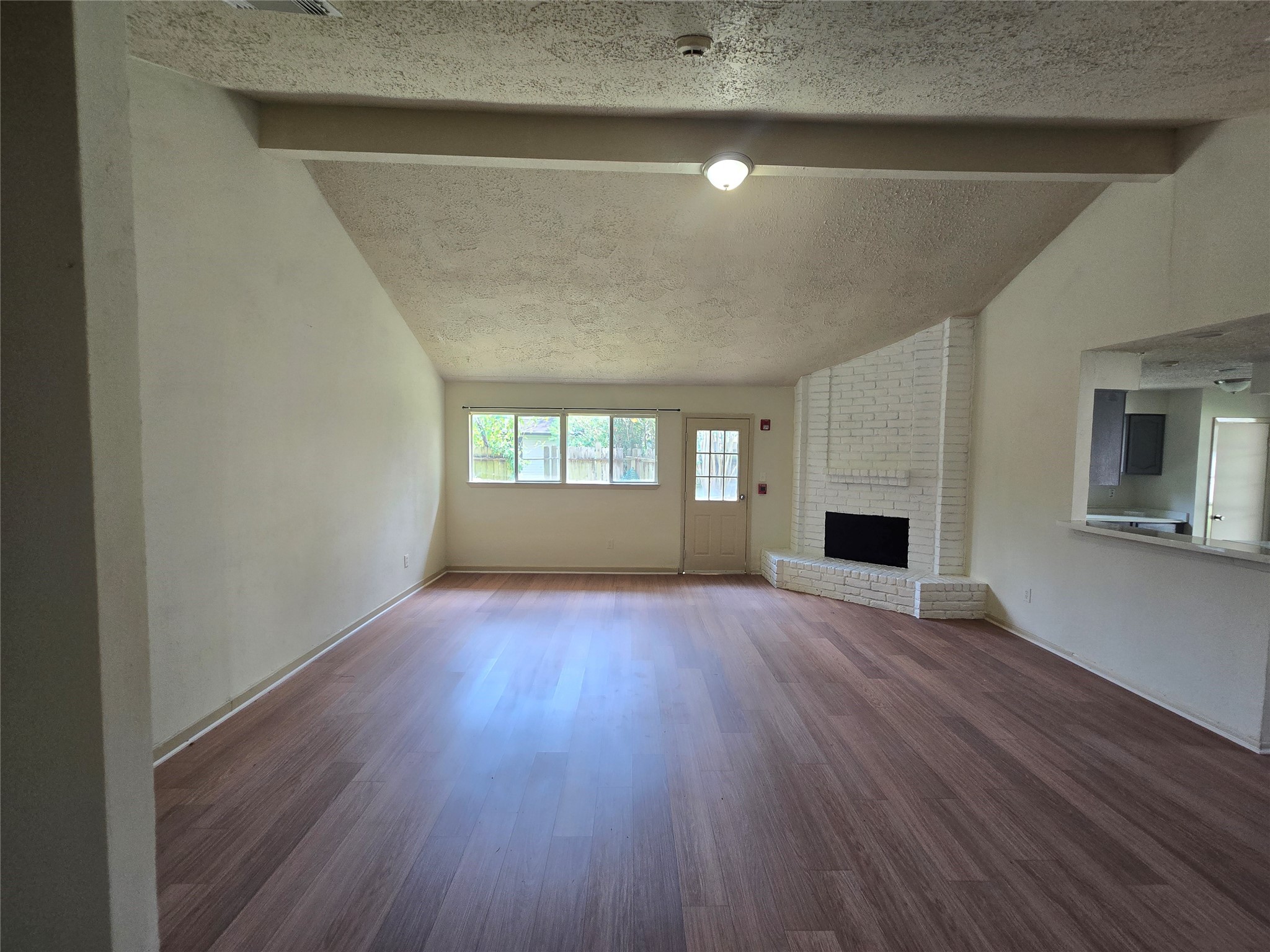 16331 Dew Drop Lane Houston, TX 77095 - Photo 5 of 20 a view of empty room with wooden floor and fireplace