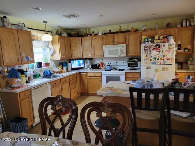 2137 Freedom Way Pocono Summit, PA 18346 - Photo 17 of 40 a kitchen that has a cabinets and a table in it