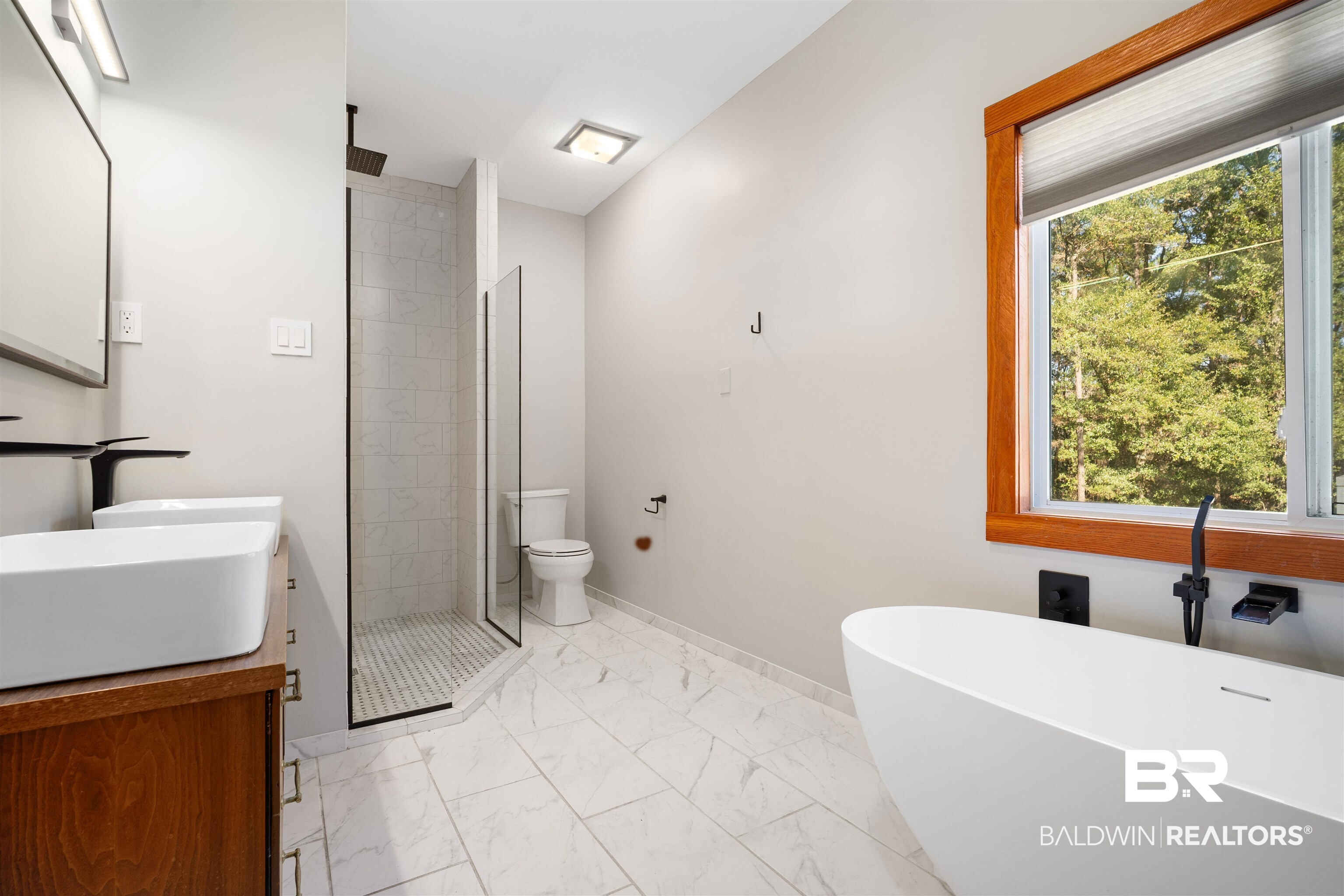 7912 Yorkhaven Road Mobile, AL 36695 - Photo 19 of 41 Bathroom featuring a freestanding bath, a shower stall, light marble finish flooring, and double vanity