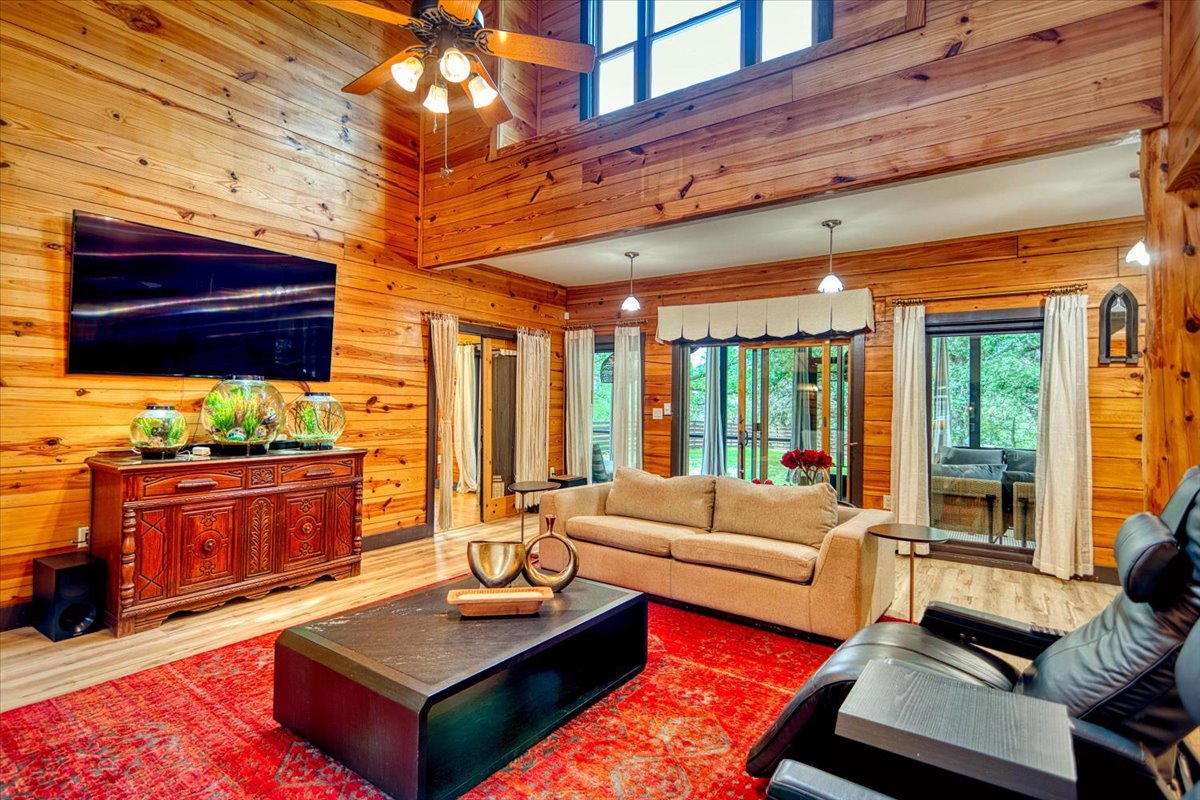 301 Blessing Ranch Road Liberty Hill, TX 78642 - Photo 11 of 40 a living room with furniture and wooden floor
