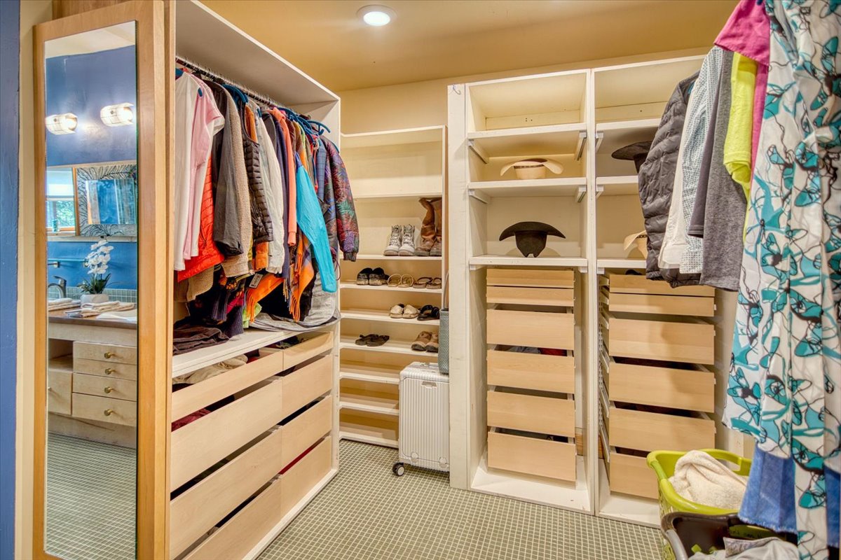 301 Blessing Ranch Road Liberty Hill, TX 78642 - Photo 15 of 40 a view of walk in closet with clothes and shoes