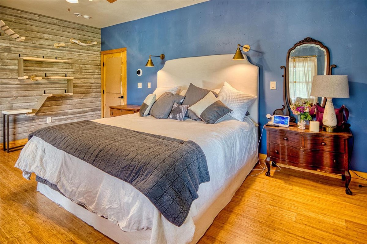 301 Blessing Ranch Road Liberty Hill, TX 78642 - Photo 16 of 40 a bed sitting in a bedroom next to a window