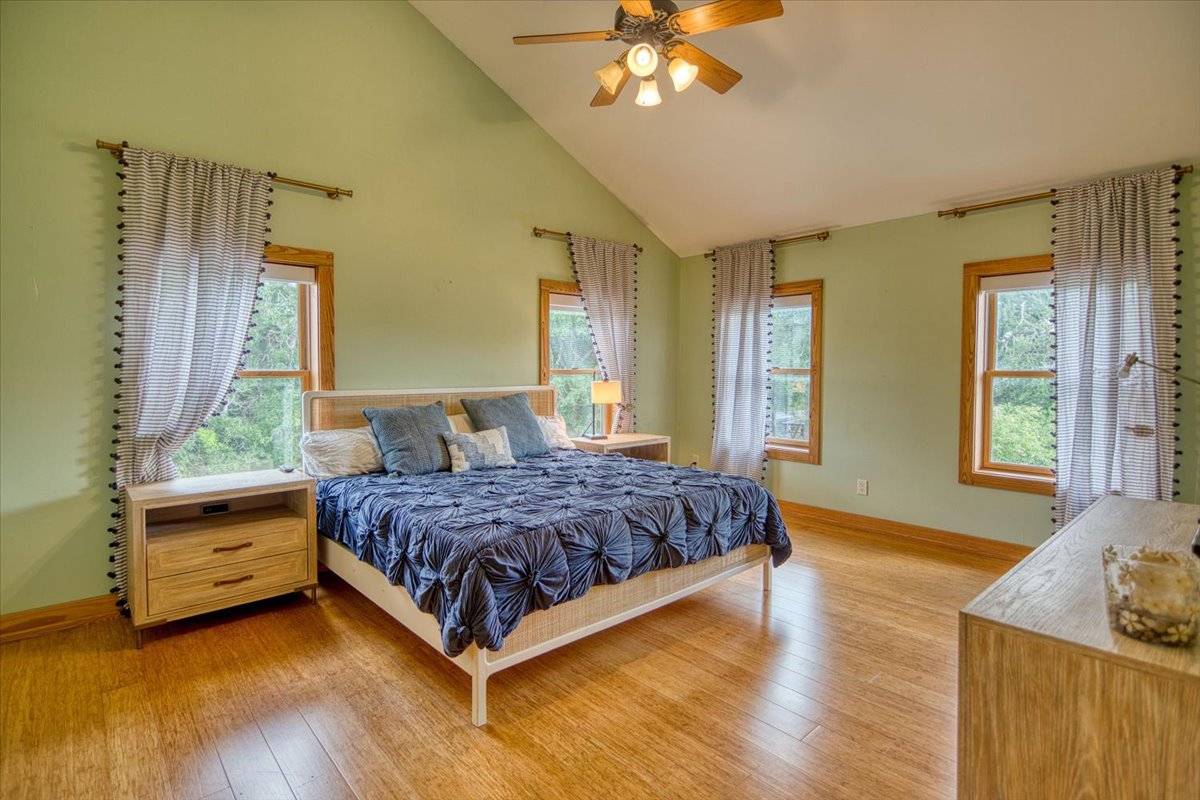 301 Blessing Ranch Road Liberty Hill, TX 78642 - Photo 19 of 40 a spacious bedroom with a bed and window