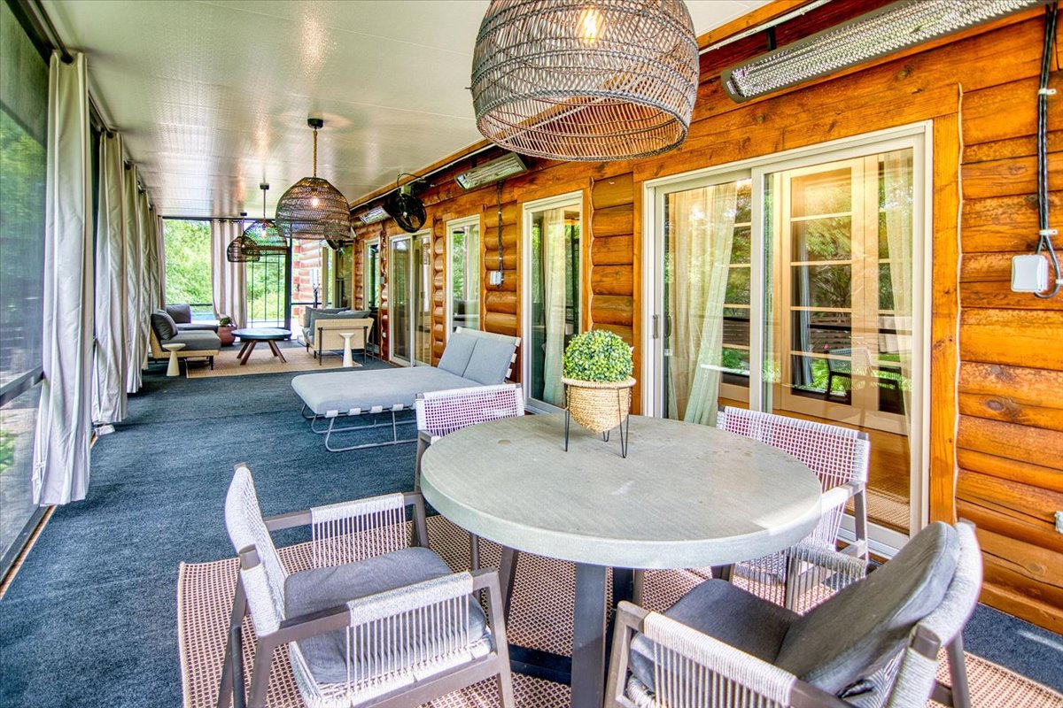 301 Blessing Ranch Road Liberty Hill, TX 78642 - Photo 28 of 40 a living room with furniture a large window and a table